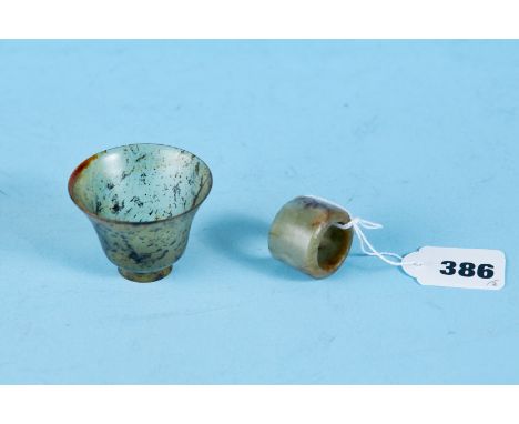 AN ANTIQUE CHINESE JADE ARCHERS RING of cylindrical form and a small translucent jade TEA BOWL, 1 3/4 ins high.  (2)   £40-£6