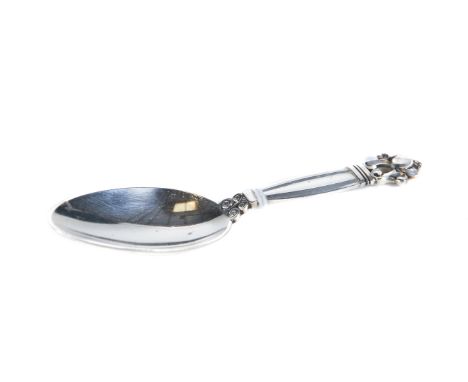 A GEORG JENSEN SILVER CADDY SPOON, foliate scroll terminal handle, oval mark, import mark for London 1962, approximately 22 g
