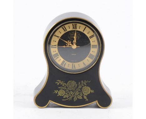 A Jaeger le Coultre "Petit Neuchateloise" alarm clock, black metal case and dial with brass roman numeral chapter ring and fl