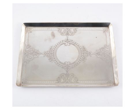 A rectangular silver dressing table tray, engine turned design and engraved with scrolls and foliate work with large central 