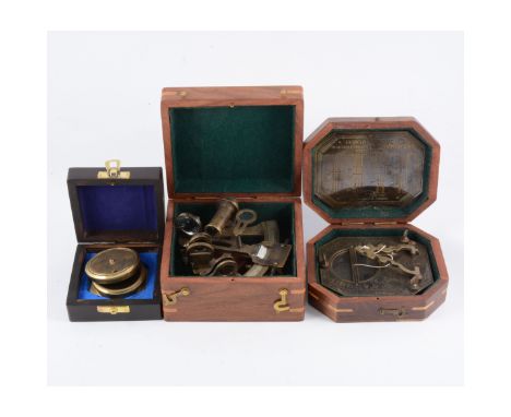 Three reproduction brass instruments in wooden boxes, compass, sundial compass and a sextant, a Kodak Brownie 127 in a black 