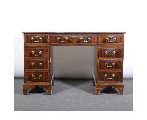 George III style mahogany desk, rectangular top with a leather inset, twin pedestals fitted with nine drawers, bracket feet, 