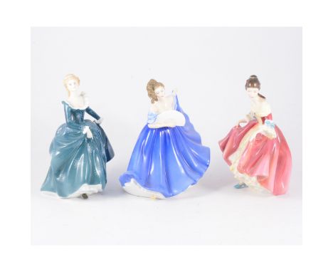 Eight Royal Doulton figurines, "Fragrance", "Beatrice", "Lisa", "Merry Christmas" "Marilyn, "Southern Belle", "Elaine", "Darl