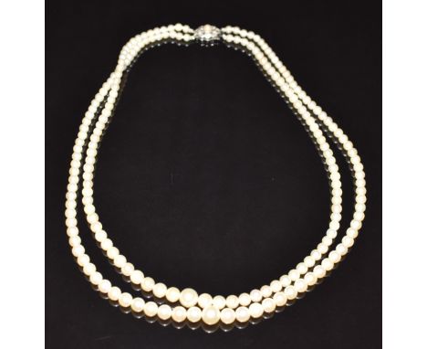 A double strand cultured pearl necklace, the 9ct white gold clasp set with a pearl