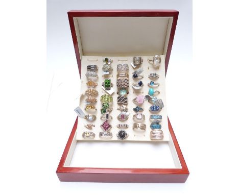 Forty two silver rings set with topaz, black diamond, sapphire, diamonds, garnets, citrine, peridot, etc