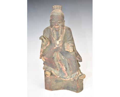 Chinese 19thC wood carving depicting a scholar with wax customs seal to back, height 20cm