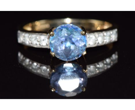 A 9ct gold ring set with Neptune topaz and white topaz, 2.8g, size N