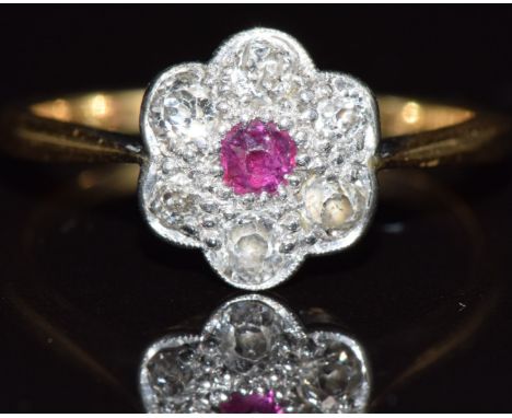 A c1915 18ct gold ring set with a ruby and diamonds, 2.4g, size M