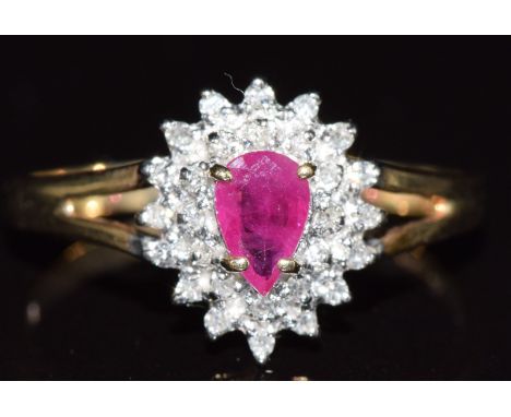 A 9ct gold ring set with a pear cut ruby and diamonds, 2g, size Q&nbsp;