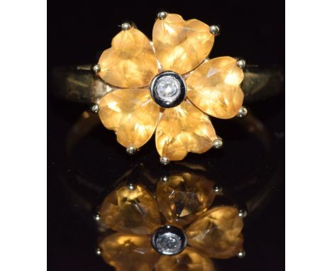 A 9ct gold ring set with five heart cut citrines and a diamond in a cluster, 2.2g, size N
