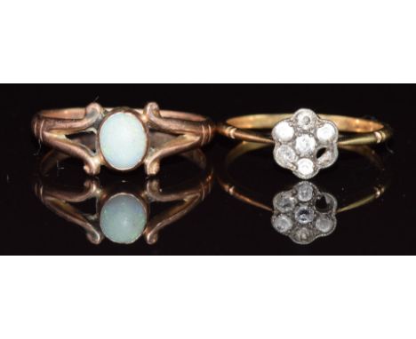 A 9ct gold ring set with an opal cabochon, Birmingham 1915 (2.3g, size O) and an 18ct gold ring set with diamonds and white s