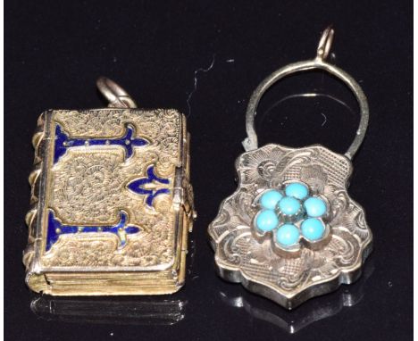 Victorian locket in the form of a book with engraved and blue enamel decoration opening to reveal four photo compartments, to