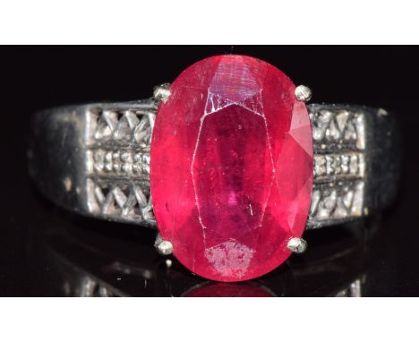 A 9ct white gold ring set with a ruby and diamonds, 6.5g, size W