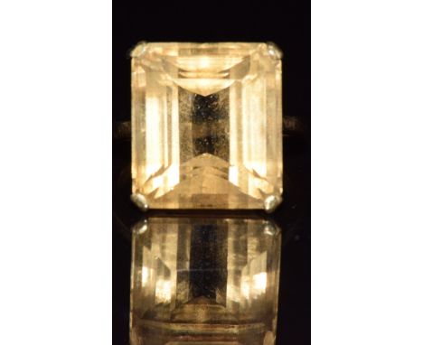 A yellow metal ring set with an emerald cut citrine, 5.9g, size J/ K&nbsp;