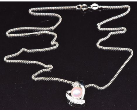 An 18ct white gold pendant in the form of a heart set with diamonds and a pearl (2g), on a 14k white gold chain, 2.6g, 44cm l