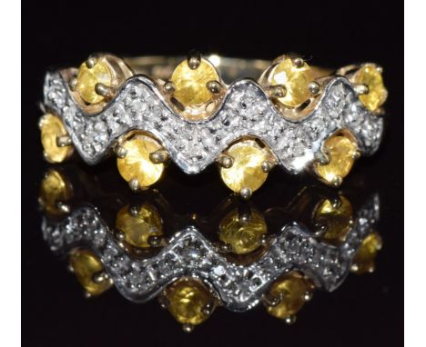 A 9ct gold ring set with yellow sapphires and diamonds, 2.6g, size M