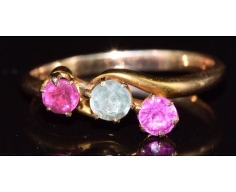 An 18ct gold ring set with an aquamarine, ruby and tourmaline, 2.4g, size N