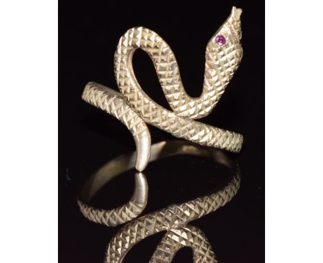 A 9ct gold ring in the form of a snake with ruby eyes, 2.6g