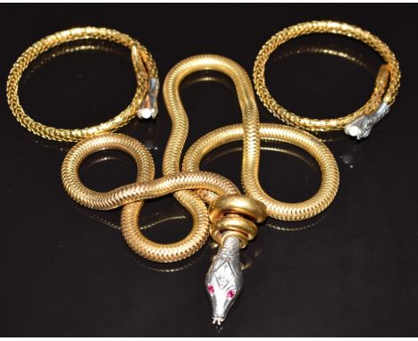 A vintage serpent necklace with synthetic ruby eyes and two rolled gold Art Deco German serpent bangles by Kollmar &amp; Jour