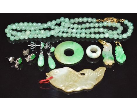 A jade fish pendant, jade bi-disc, two jade pendants, 14k white gold earrings set with jade and a pair of white metal earring