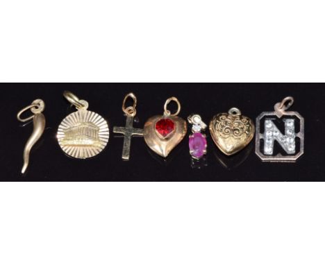 Six 9ct gold pendants including ruby and diamond, hearts,&nbsp;cross and letter N (2.4g) and 14k gold parthenon example, 1.4g