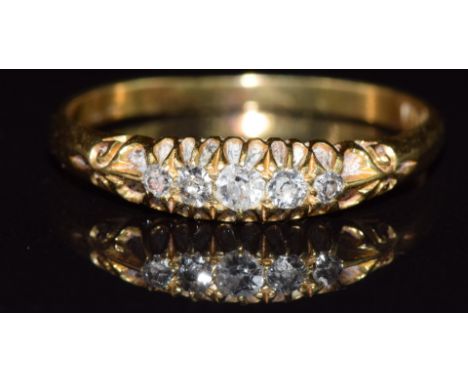 An 18ct gold ring set with five diamonds, in vintage box, 2.8g, size Q