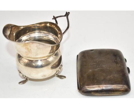 Hallmarked silver cigarette case together with a hallmarked silver milk jug raised on three feet, Chester 1919, maker's mark 