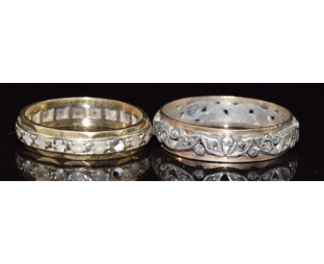 An 18ct gold eternity ring set with spinel (3g, size L/M) and a 9ct gold and silver eternity ring set with marcasite&nbsp;