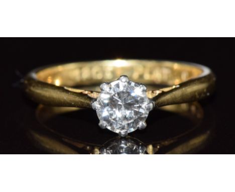 An 18ct gold ring set with a round cut diamond of approximately 0.4ct in a platinum setting, 2.5g, size J/K