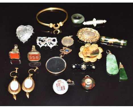 A collection of Victorian jewellery including horseshoe bangle, painted miniature set into a gilt brooch, two silver Mizpah b