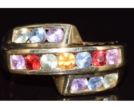 A 9ct gold ring set with multi coloured sapphires, 2.6g, size J