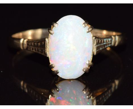 A 9ct white gold ring set with an opal cabochon, 1.8g, size R