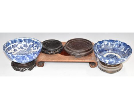 Five Chinese hardwood stands and two Japanese pedestal bowls, largest stand 31 x 20cm, bowls H7 x D18cm