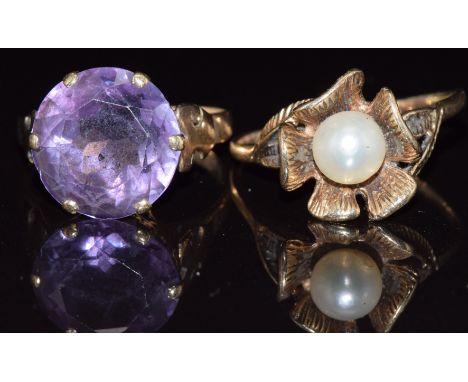 Two 9ct gold rings, one set with synthetic purple sapphire the other a pearl, 7.9g, size S &amp; O