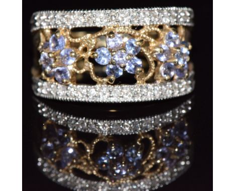 A 9ct gold ring set with tanzanites and diamonds, 3.7g, size N