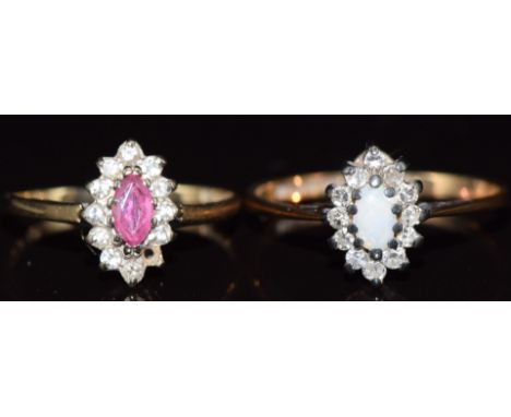 Two 9ct gold rings, one set with a ruby and diamonds in a marquise shaped setting and the other opal and diamonds, 2.9g, size