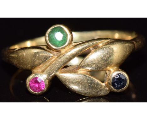 An 18ct gold ring set with an emerald, ruby and sapphire, 3.2g, size K