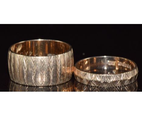 Two 9ct gold bands with cut out decoration, 6.3g, size K &amp; L