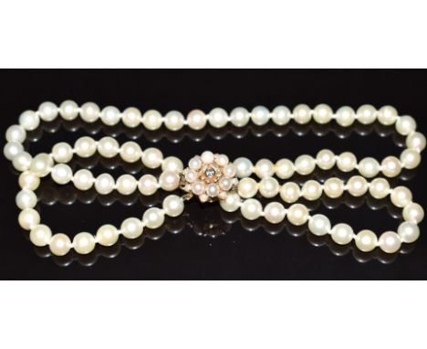 A double strand cultured pearl necklace, the 9ct gold clasp set with a diamond and pearls, 57.6g&nbsp;