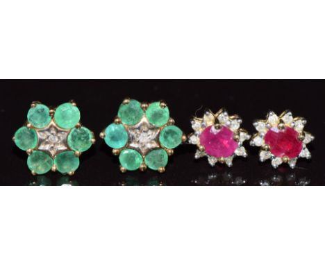 Two pairs of 9ct gold earrings, one set with a diamond and emeralds and the other pair a ruby and diamonds, 3.4g