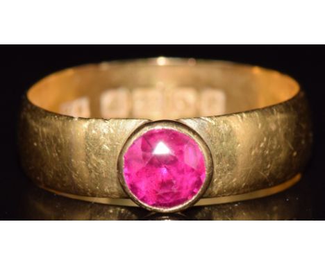 A 22ct gold ring set with a round cut ruby, Birmingham 1916, 4.6g, size O