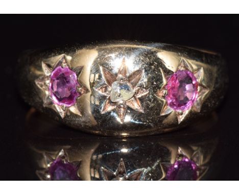 Edwardian 9ct gold ring set with a diamond and two rubies in a star setting, 3.7g, size N