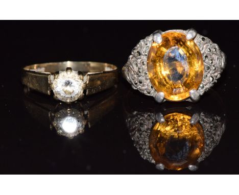 A 9ct gold ring set with cubic zirconia (1.8g, size L) and a 9ct gold and silver ring set with a citrine and marcasite, size 