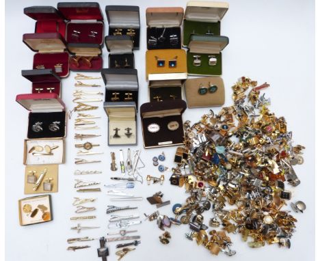 A large collection of cufflinks and tie clips including mother of pearl, rolled gold, bloodstone, 1950's football, Toledo, wh