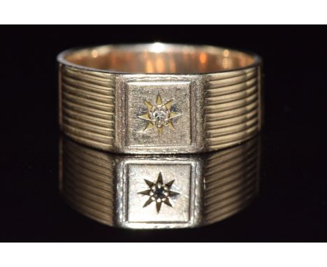 A 9ct gold ring set with a diamond in a star setting, 5.3g, size T