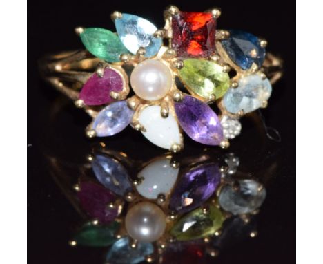 A 9ct gold ring set with garnet, ruby, emerald, sapphire, amethyst, peridot, opal, pearl, topaz and aquamarine, 3.1g, size U