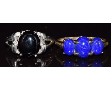 Two 9ct gold rings, one white gold set with onyx, the other set with lapis lazuli, 6.6g, size U &amp; R