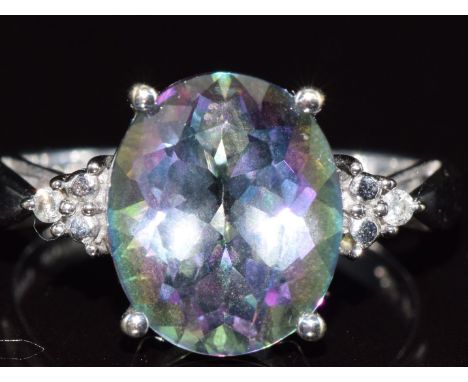 A 9ct white gold ring set with a topaz and diamonds, 4g, size N