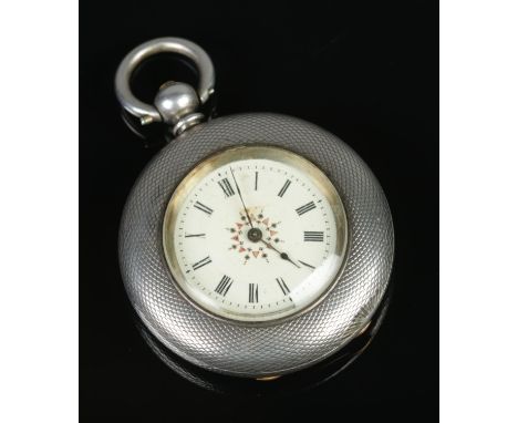 A silver fob watch with engine turned case and monogram to back, stamped fine silver on the inside of case.