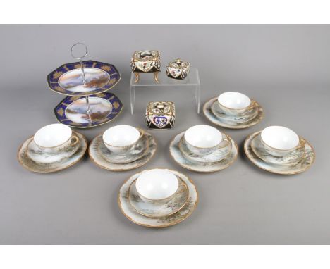 A collection of oriental ceramics to include Noritake cake stand and trinket boxes along with a quantity of hand painted trio